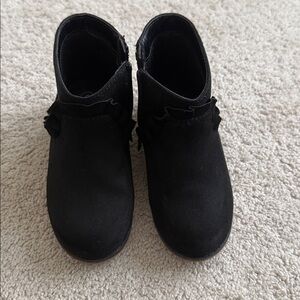 Black zip up booties with ruffles. Size 9